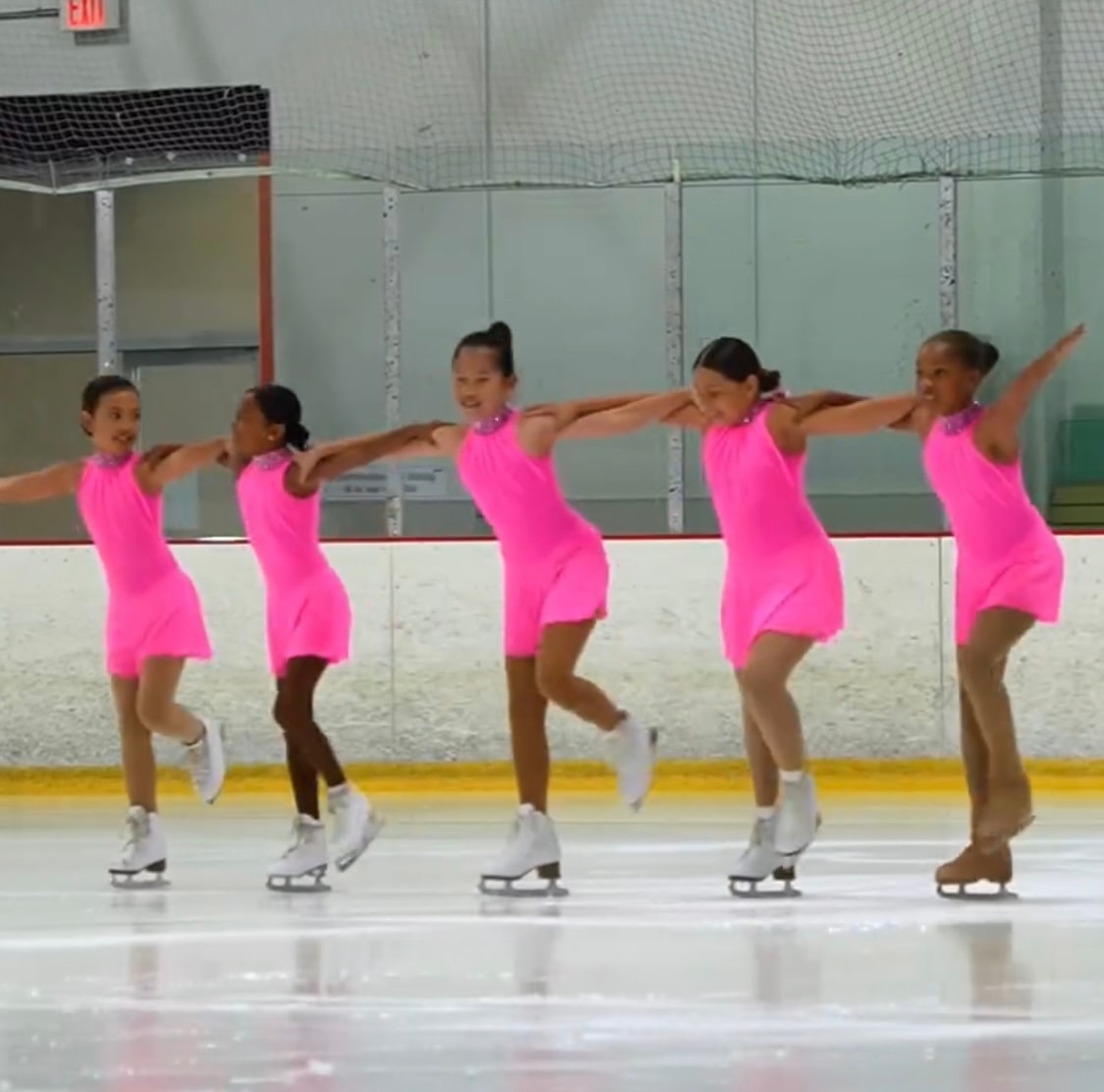 Darlene Sparks coaching a skater on the ice